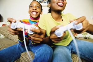 two girls play video games