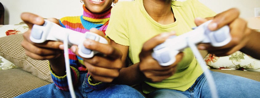 two girls play video games