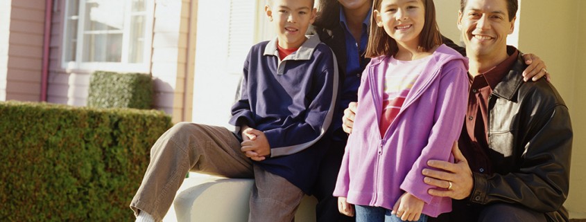 family of four on front porch