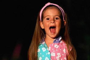 young girl singing loudly