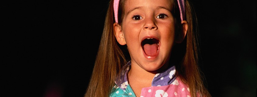 young girl singing loudly