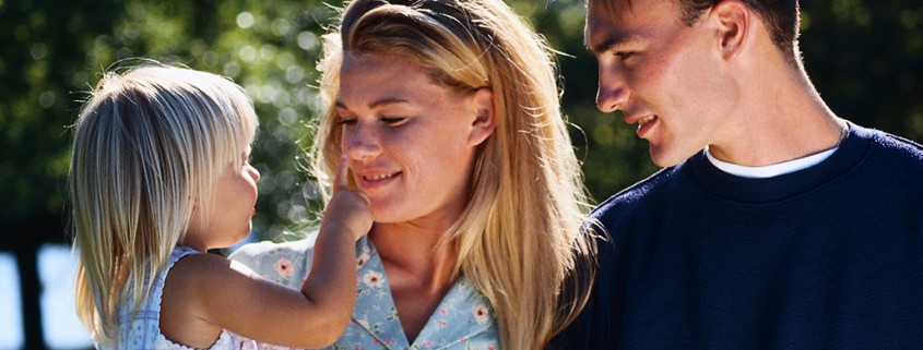 parents and daughter outdoors