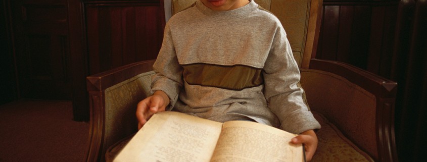 boy in chair reading