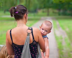 mother with baby walking down path