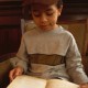 young boy reading a book