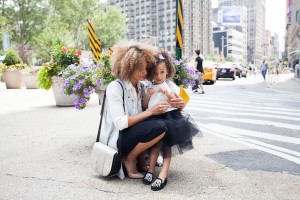 mother and daughter on the street in a city