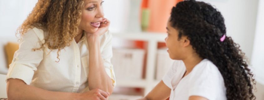 Mother talking with daughter (10-11)