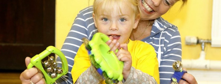 mother and daughter playing with toys