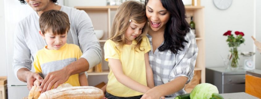 Positive family preparing lunch together
