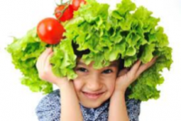 Child with vegetables on their head